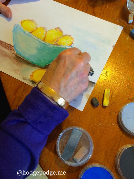 Nana painting lemons in chalk pastel